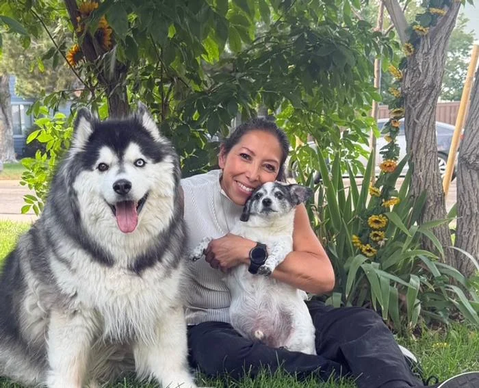 Hope with her own dogs, Misha the Alaskan Malamute and Oreo the Jack Russell and Chihuahua mix